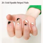 1688752102_Geometric-Gold-Striped-Nails.jpg