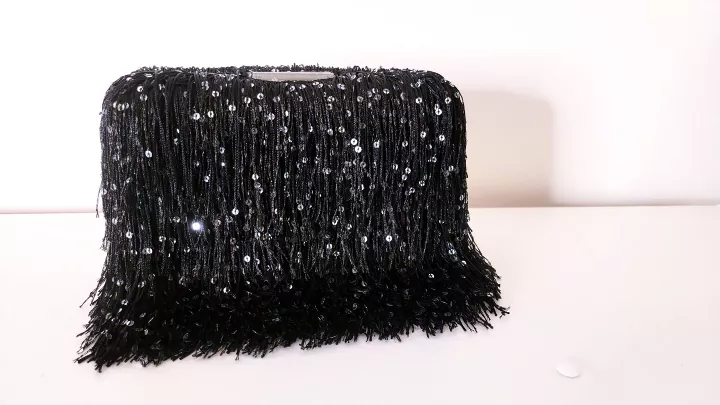 Enhance Your Style with a Chic Fringed Clutch