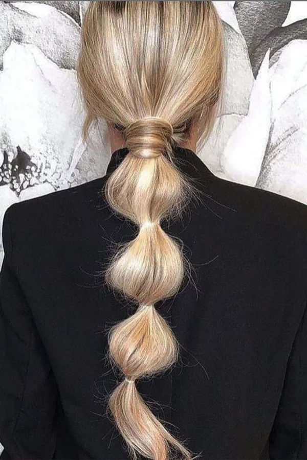 Adding a touch of whimsy with a bubble ponytail: Enhance your beauty with this fun hairstyle idea